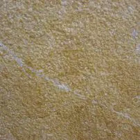 Extra bush-hammered Giallo Reale marble