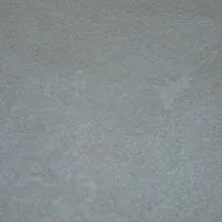 Bush-hammered Botticino marble