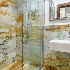 Bathroom in light quality Giallo Siena marble
