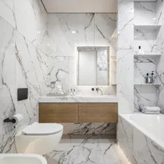 Carrara Statuario marble bathroom with white sanitary ware