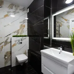 Sahara noir and Calacatta gold marble bathroom