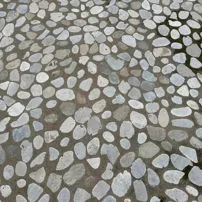 Sawn cobblestones laid on a road