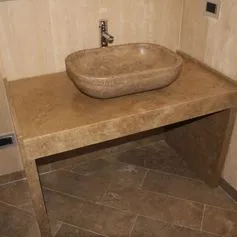 Travertine marble bathroom with oval bowl
